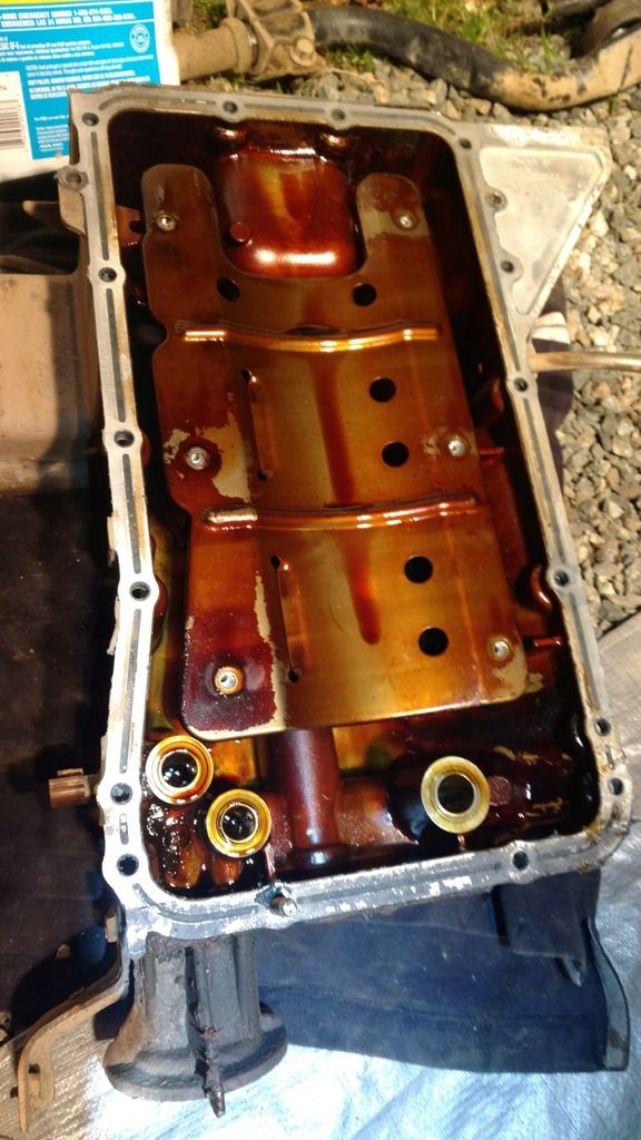 Dropped Lower Oil Pan, White RTVlike Pieces found Inside Second